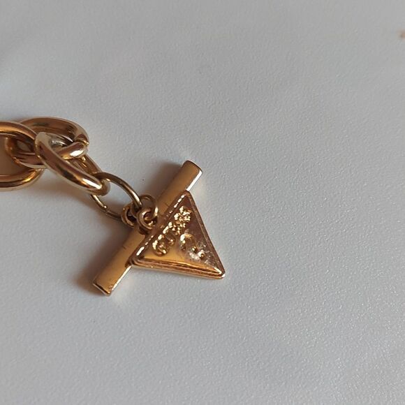 GUESS Gold Tone Heart Paved and  Logo Charms Toggle Clasp Bracelet - Picture 3 of 5